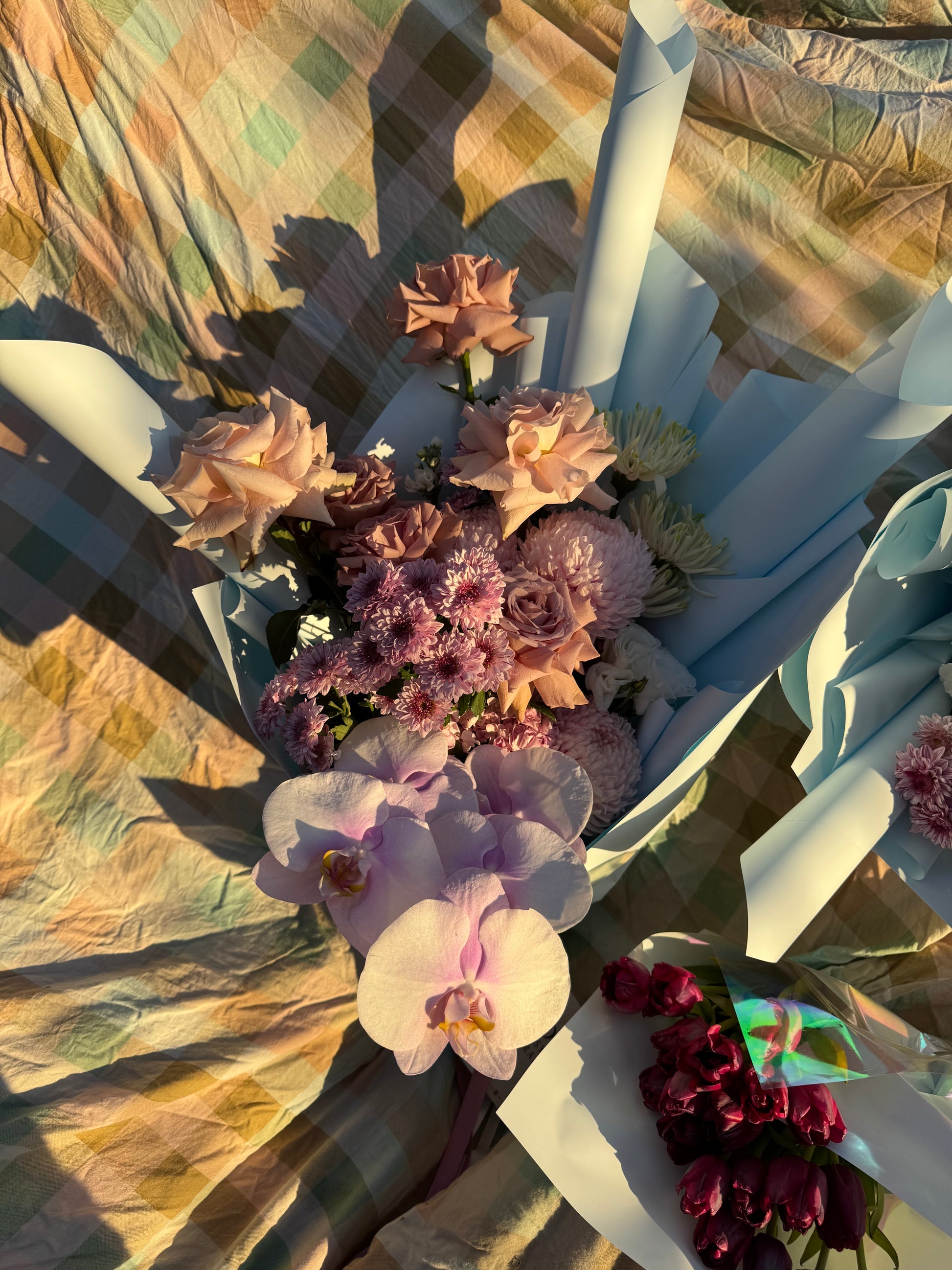 Bouquet of orchids, roses, purple and pink flowers